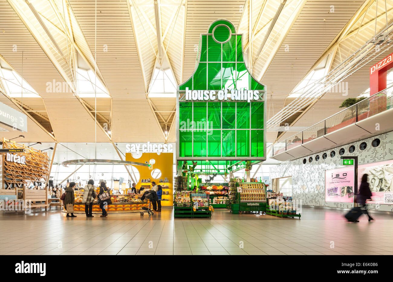 Amsterdam Schiphol Airport departure lounge 3 with Tulips Cheese souvenir souvenirs shop shops store stores passengers shopping Stock Photo