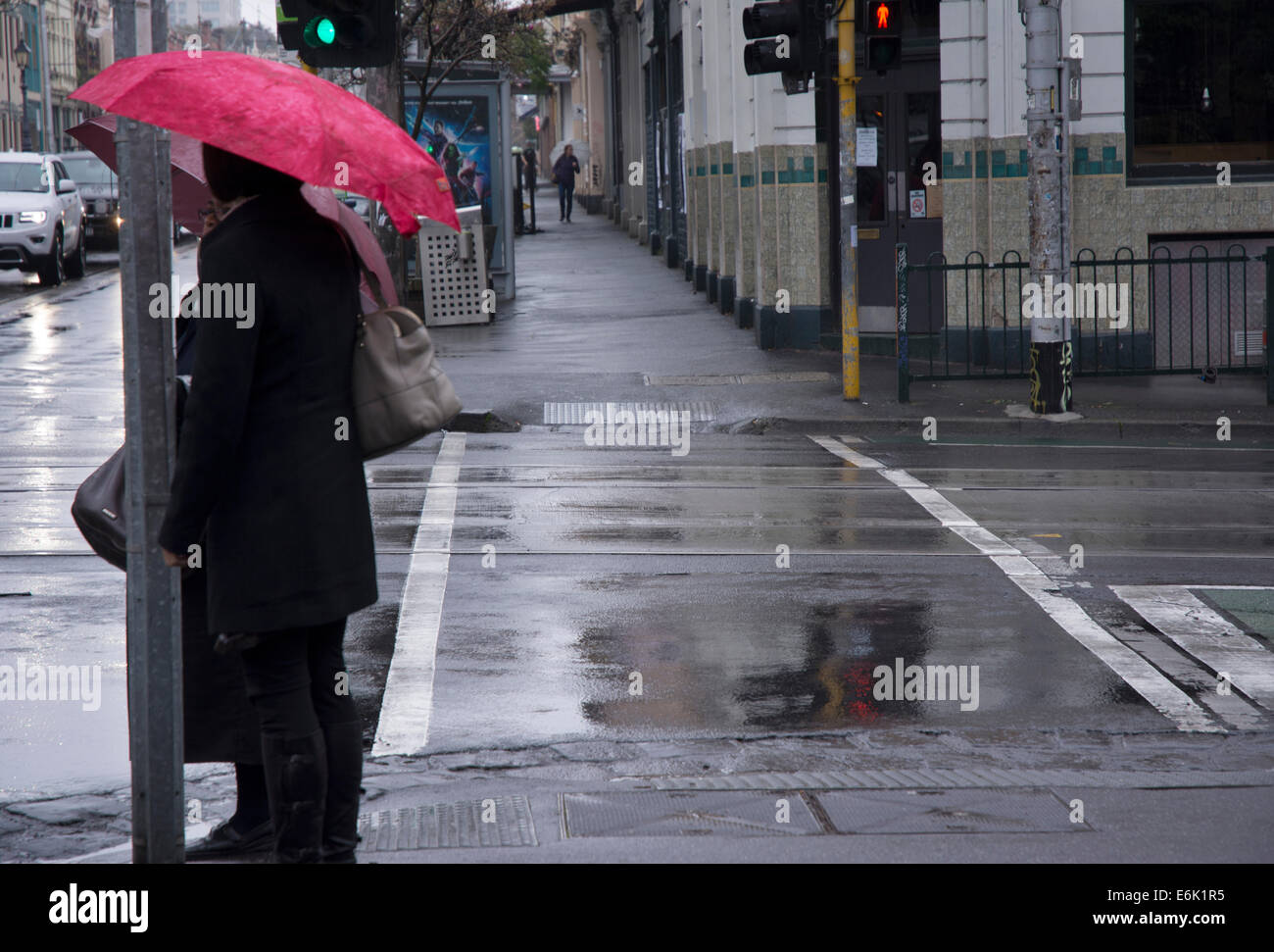 Pedestrians with umbrella Stock Photo - Alamy