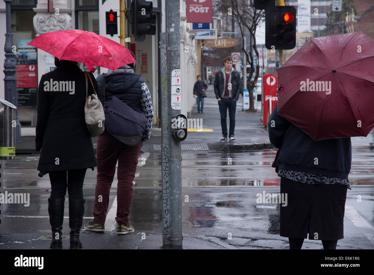 Pedestrians with umbrella Stock Photo - Alamy
