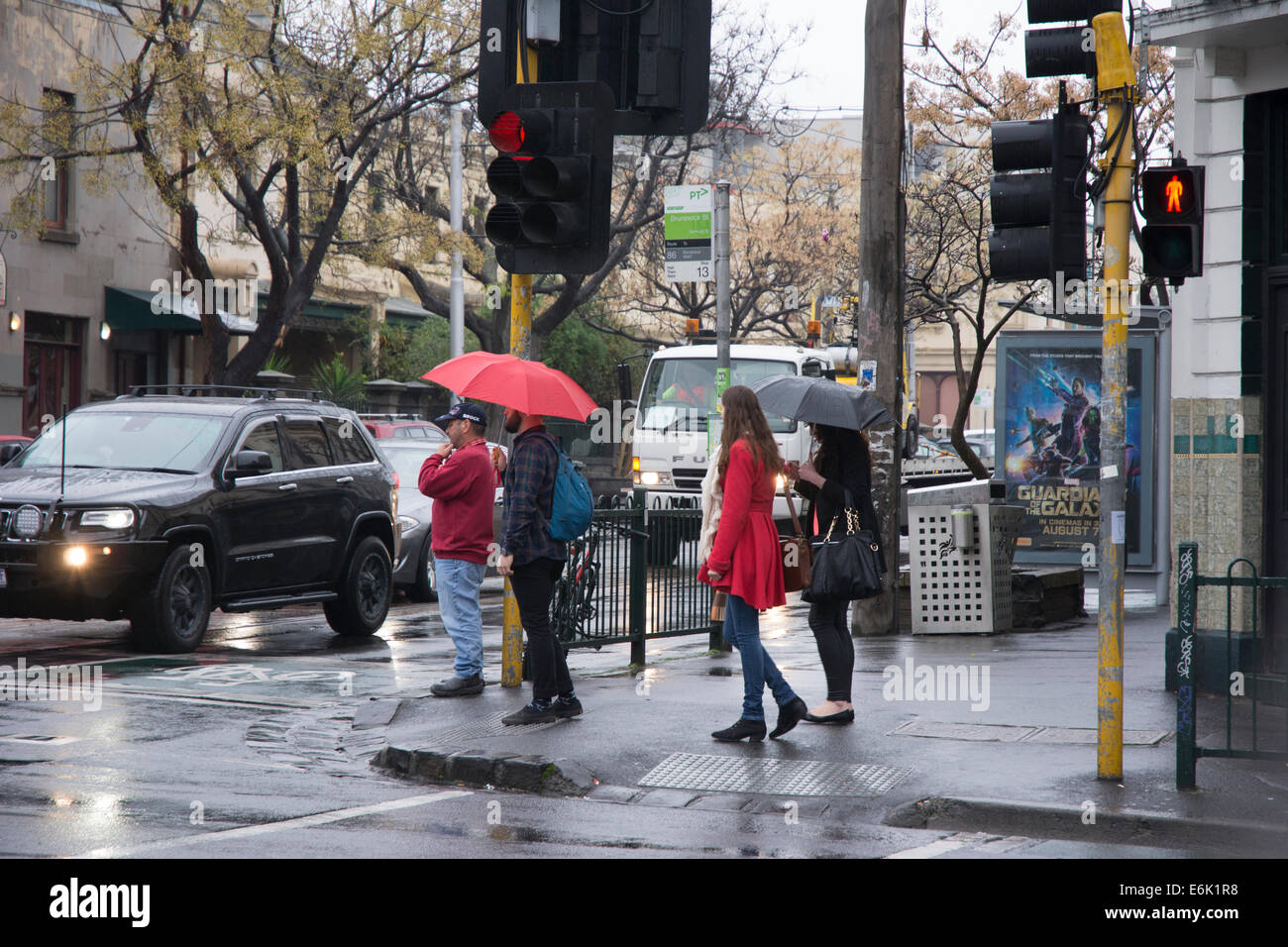 Pedestrians with umbrella Stock Photo - Alamy