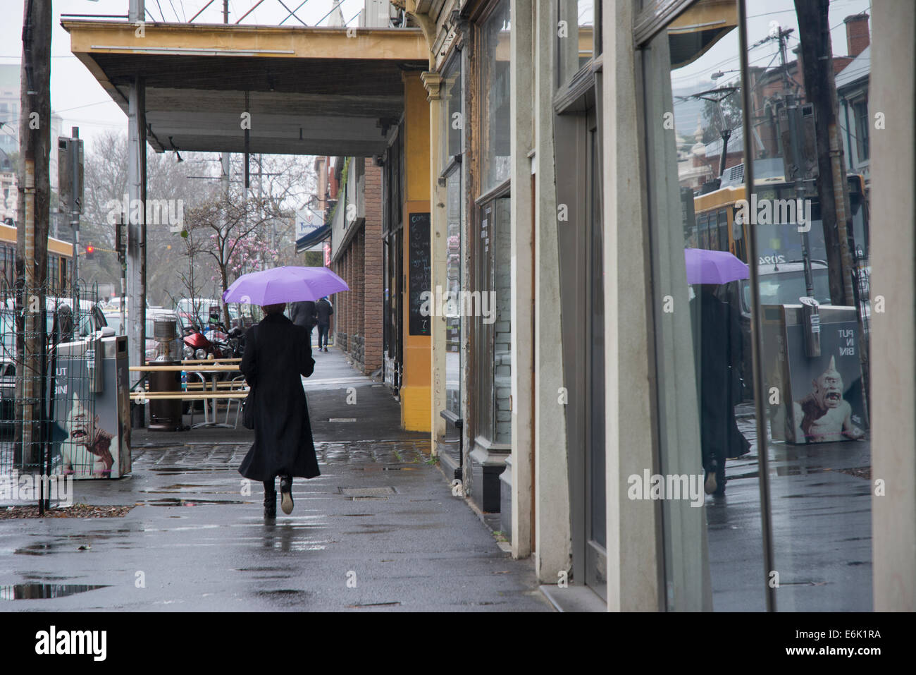 Pedestrians with umbrella Stock Photo - Alamy