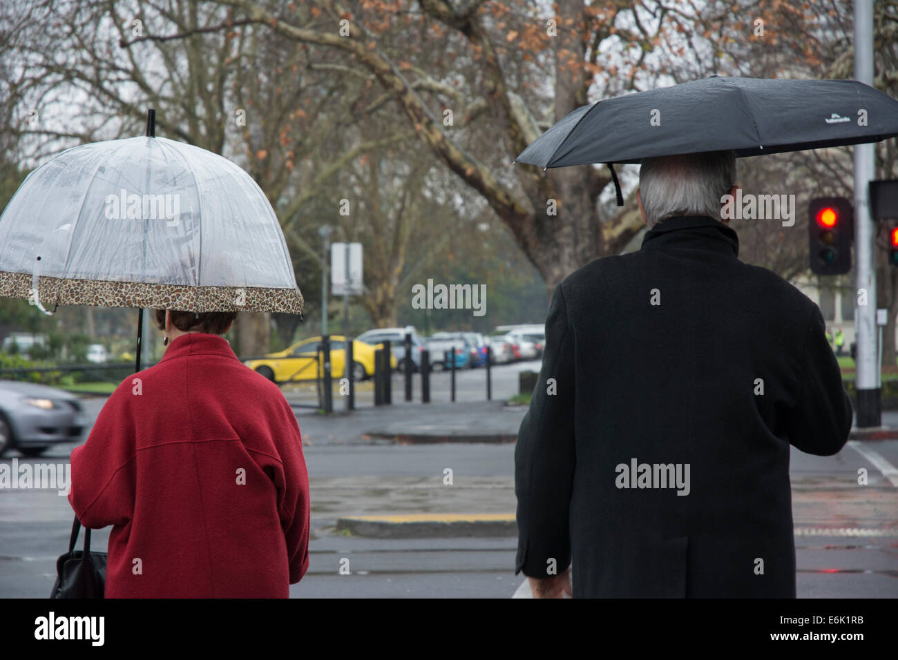 Pedestrians with umbrella Stock Photo - Alamy