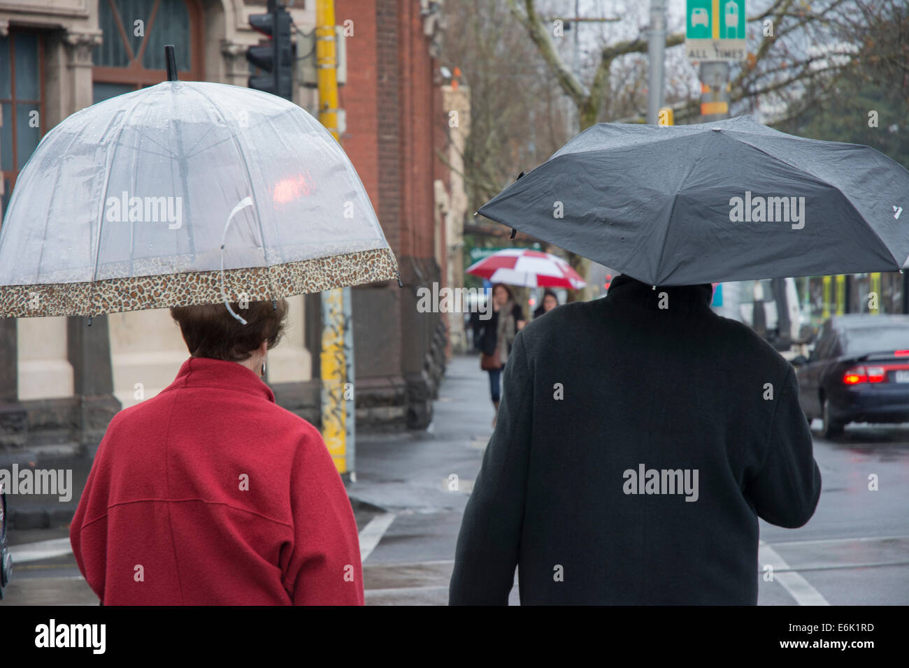 Pedestrians with umbrella Stock Photo - Alamy