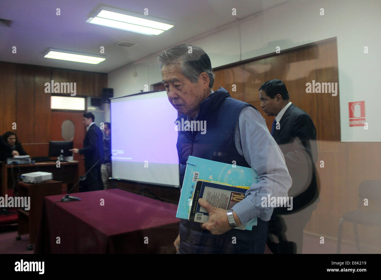 Lima, Peru. 25th Aug, 2014. Former Peruvian President Alberto Fujimori (2nd R) attends his trial on the 'Chicha Newspapers' case, at the Direction of Special Operations of National Police (DINOES, for its acronym in Spanish), in Lima City, capital of Peru, on Aug. 25, 2014. The hearing of Fujimori's trial on the buying of notes of different newspapers with the State money, known as 'Chicha Newspapers' case, was held at the Fourth Liquidator Penal Hall of Lima's Higher Court of Justice, according to local press. © Luis Camacho/Xinhua/Alamy Live News Stock Photo