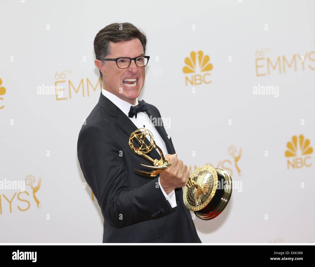 Los Angeles, CA, USA. 25th Aug, 2014. Stephen Colbert, Outstanding Variety, Music Or Comedy Series Winner and Outstanding Writing for a Variety Series, both for 'The Colbert Report', in the press room for The 66th Primetime Emmy Awards 2014 EMMYS - Press Room, Nokia Theatre L.A. LIVE, Los Angeles, CA August 25, 2014. Credit:  James Atoa/Everett Collection/Alamy Live News Stock Photo