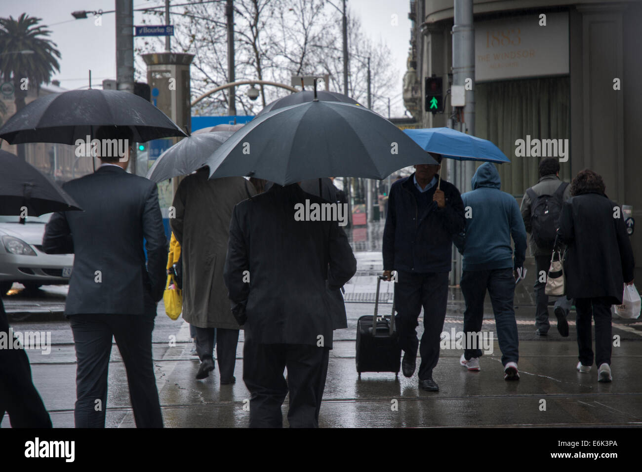 Pedestrians with umbrella Stock Photo - Alamy
