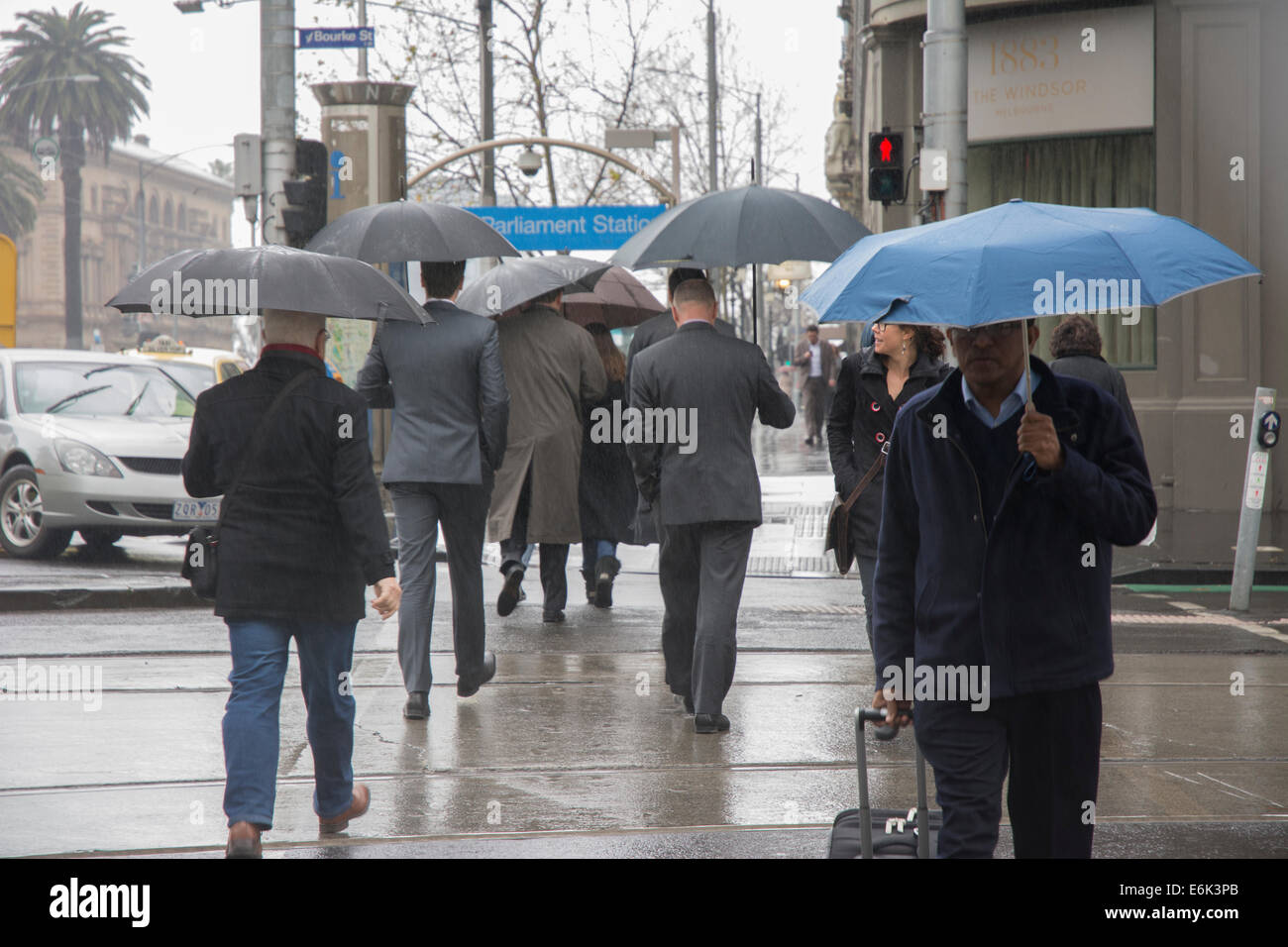 Pedestrians with umbrella Stock Photo - Alamy
