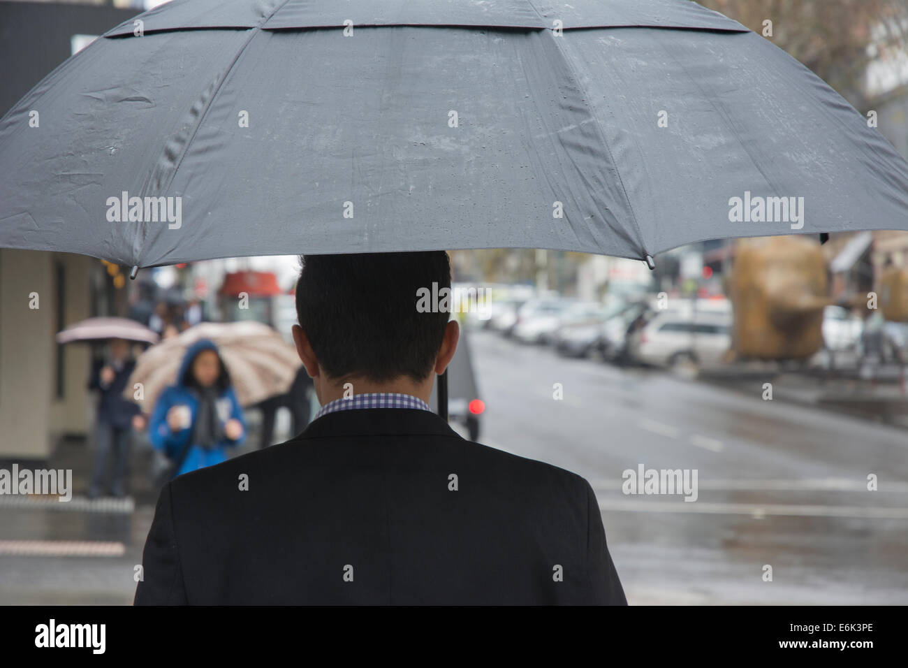 Pedestrians with umbrella Stock Photo - Alamy