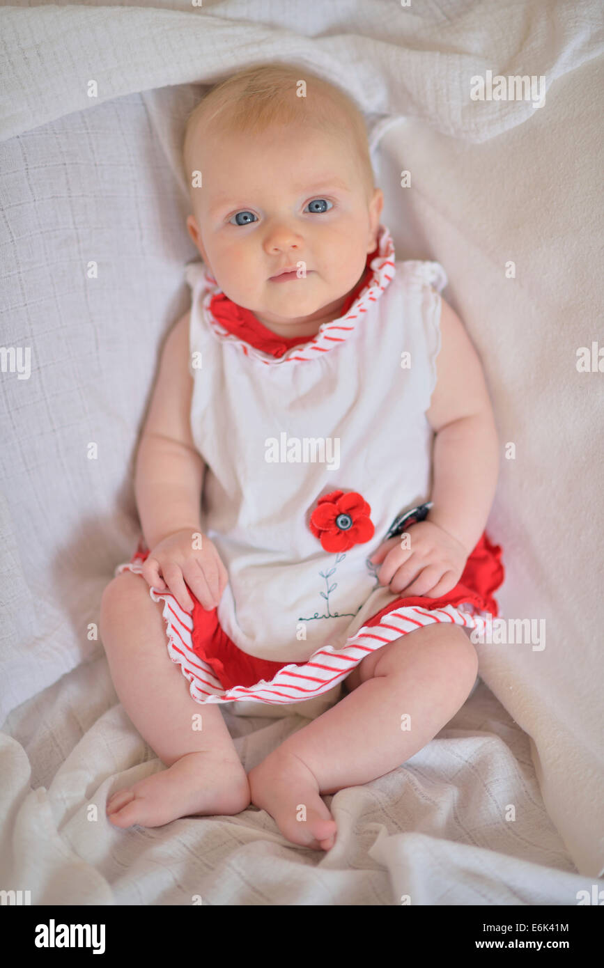 Baby girl 4 months wearing a dress Stock Photo Alamy