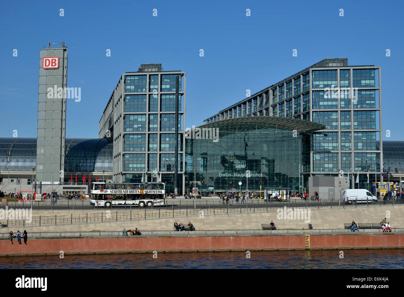 Sightseeing bus in front of Berlin Hauptbahnhof main railway station, Spree River at the front, Berlin, Germany Stock Photo