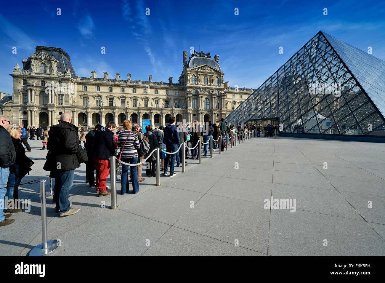 Queue in front of the entrance pyramid of the Louvre Museum designed by architect IM Pei, Musée du Louvre, Paris Stock Photo