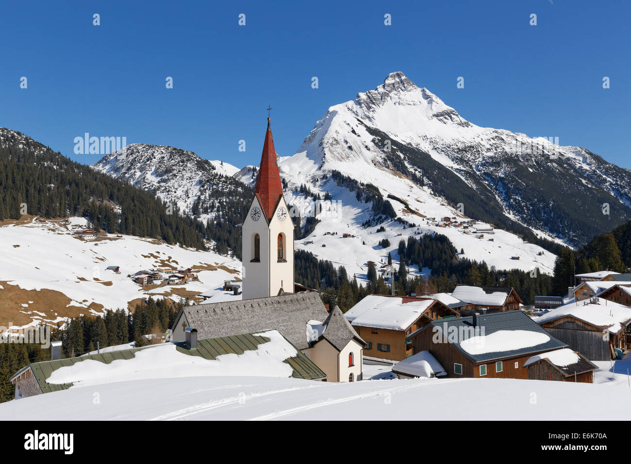 View of the community of Warth, Bregenz Forest, Vorarlberg, at the back Mt Biberkopf in Tyrol, Austria Stock Photo