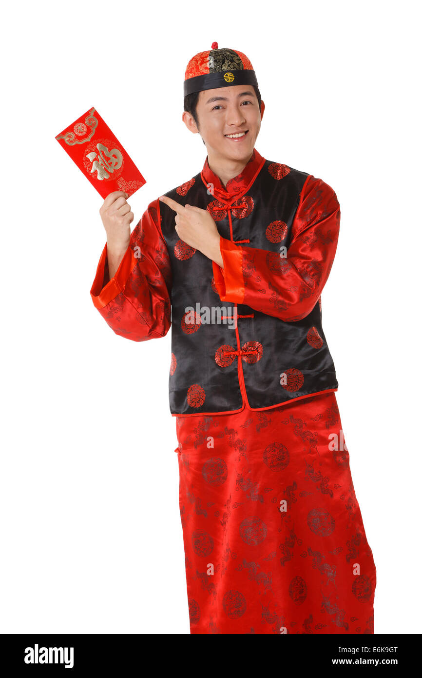 Young man in Chinese traditional clothes with red envelopes celebrating Chinese New Year Stock Photo