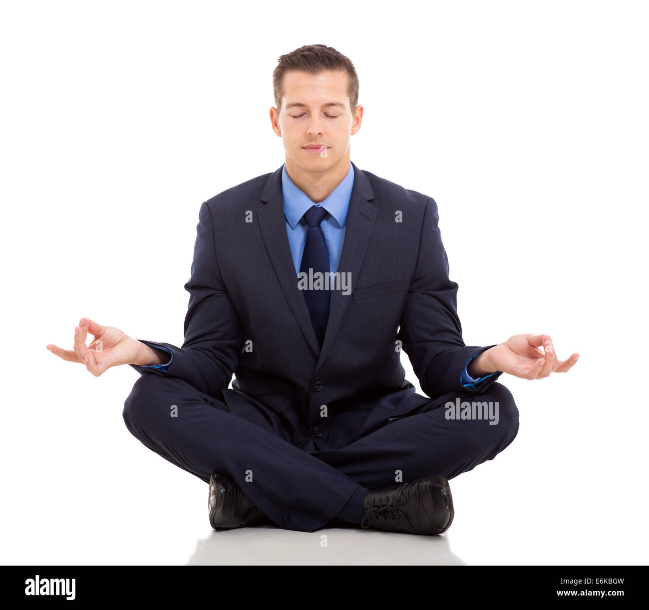 peaceful businessman meditating on white background Stock Photo - Alamy