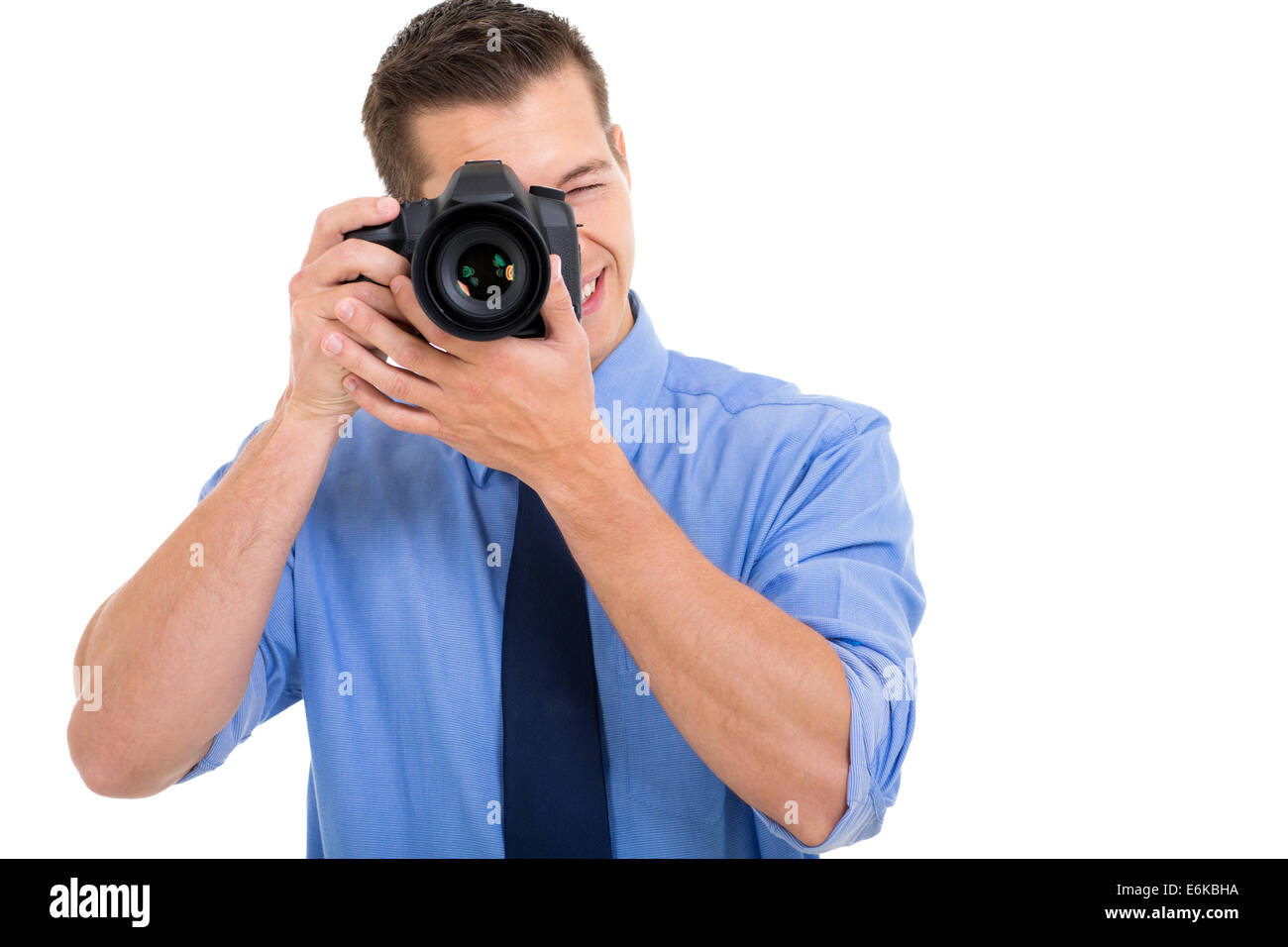 male photographer taking photo on white background Stock Photo Alamy