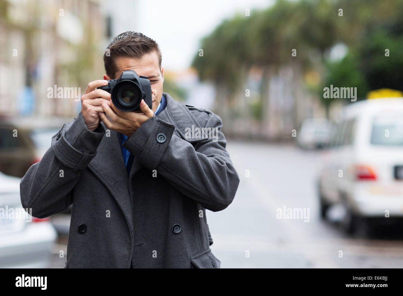 professional journalist taking photos outdoors Stock Photo