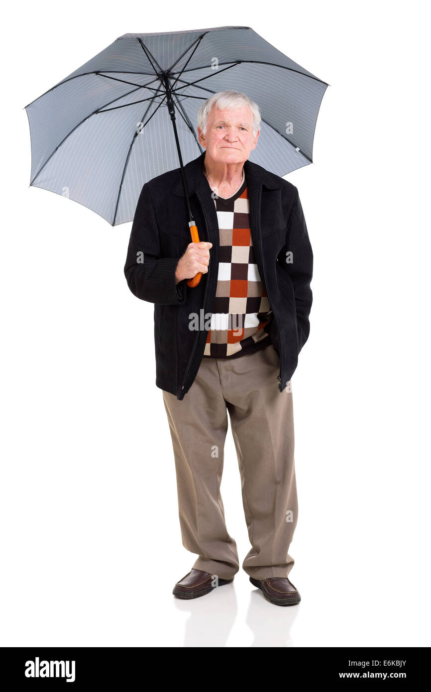 senior man standing under an umbrella on white background Stock Photo