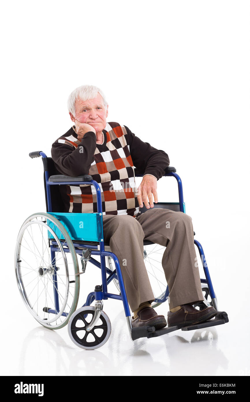 sad disabled senior man sitting on a wheelchair over white background Stock Photo