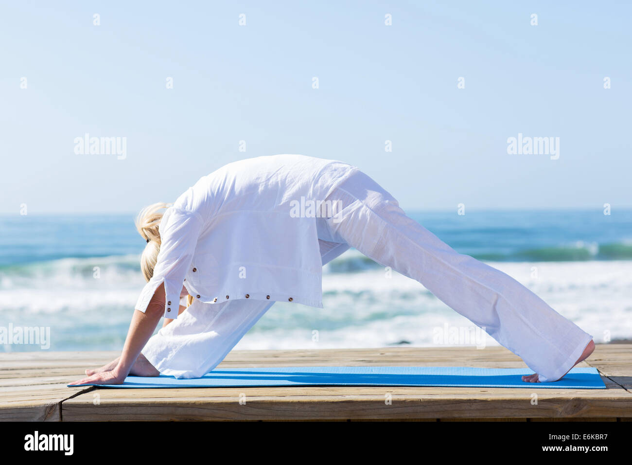 Middle aged woman doing yoga hi-res stock photography and images - Alamy
