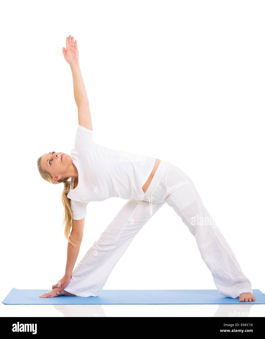 fit middle aged woman yoga pose isolated on white background Stock Photo
