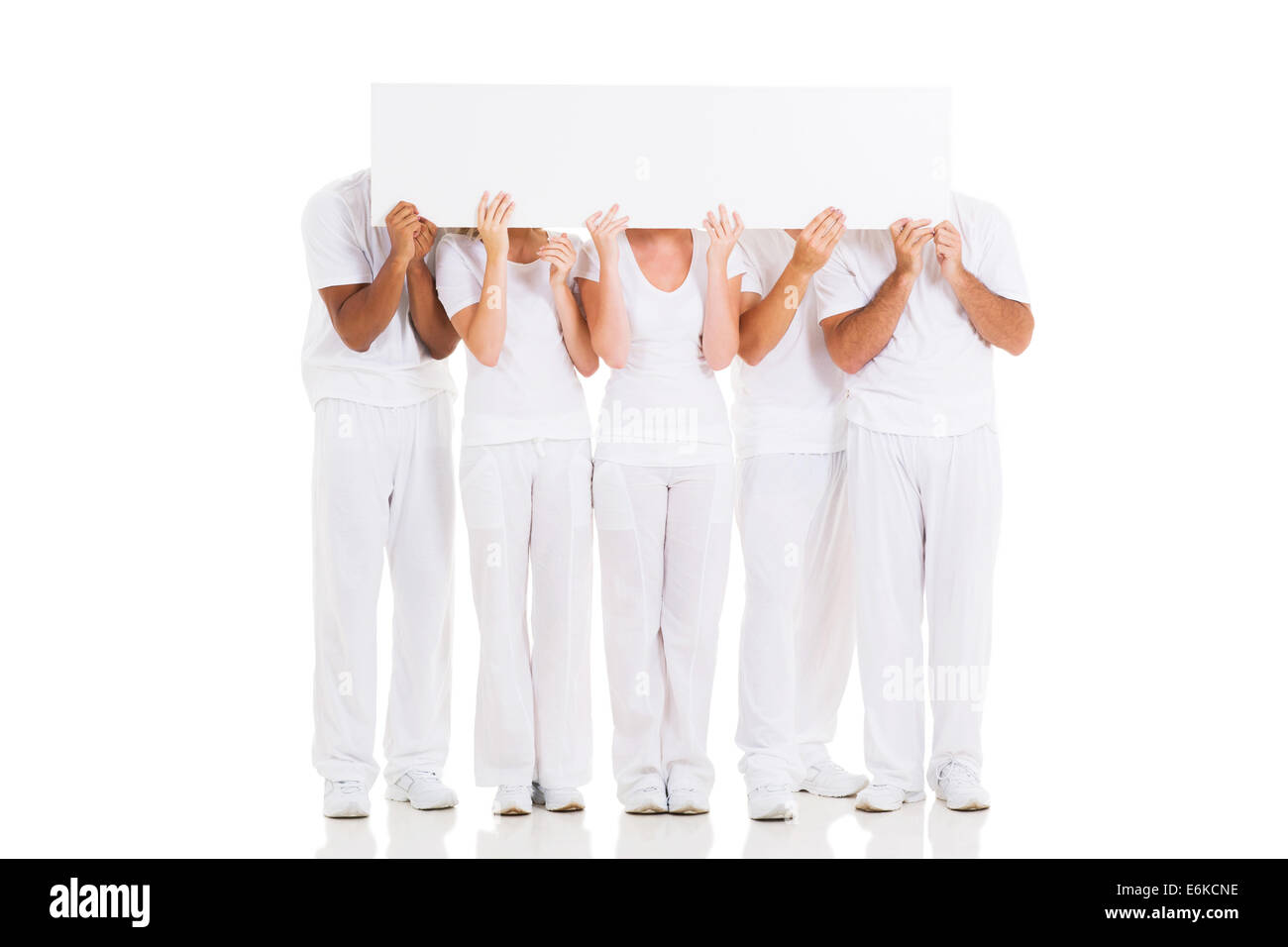 group of people hiding their faces behind white board Stock Photo - Alamy