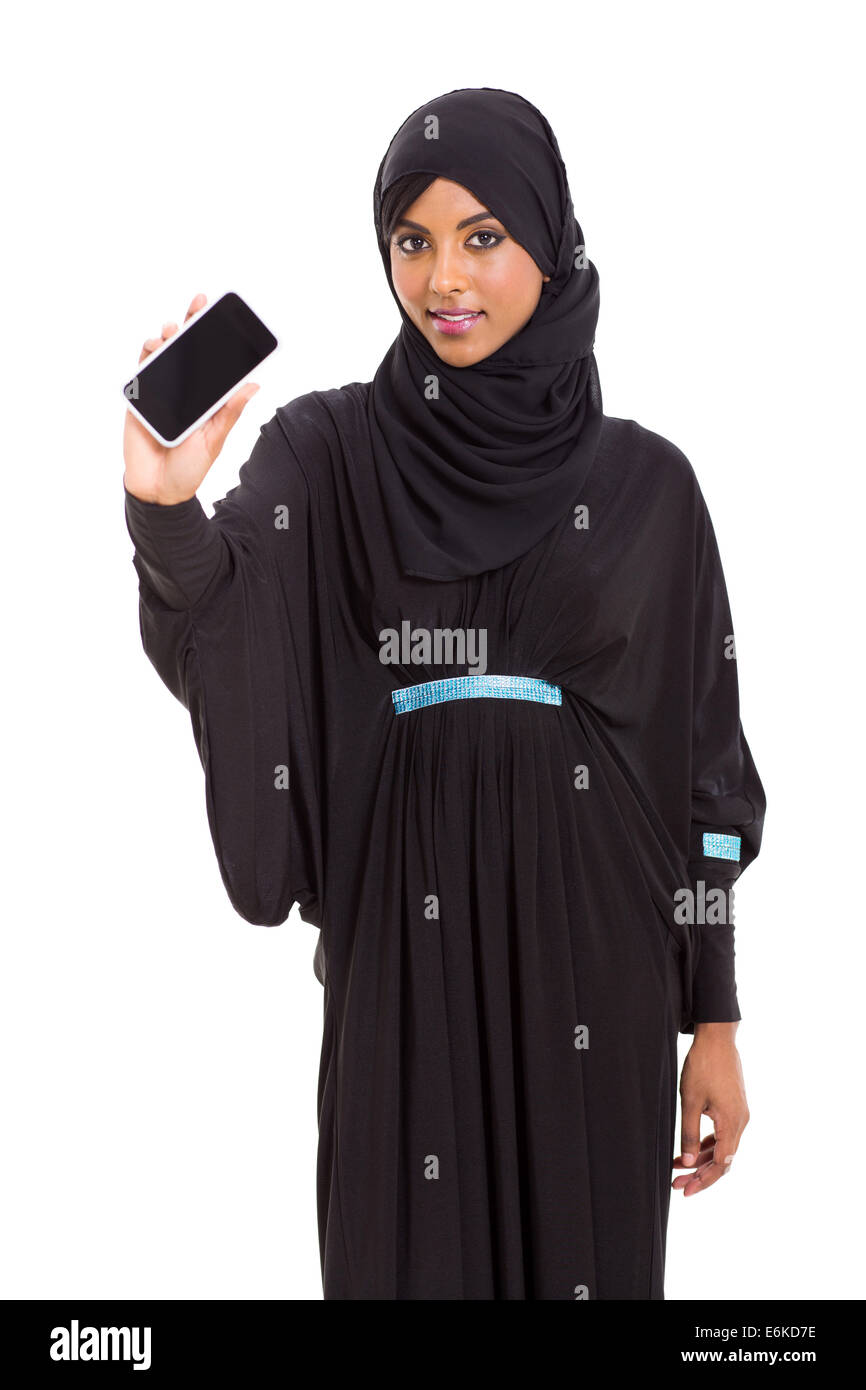 beautiful young Arabian woman showing smart phone over white background ...