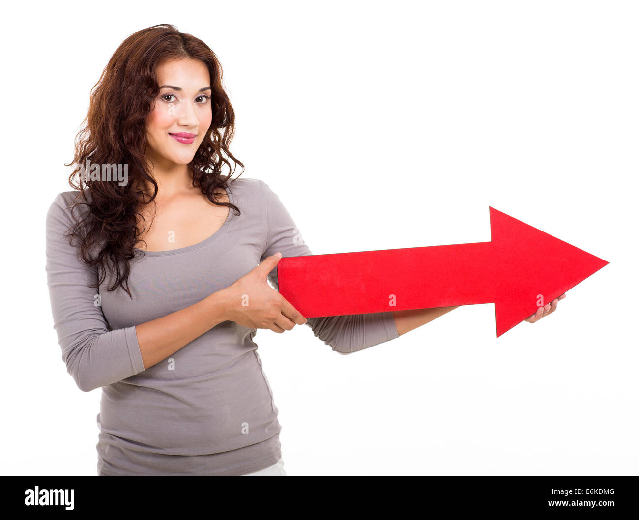 woman holding big direction arrow on white background Stock Photo - Alamy