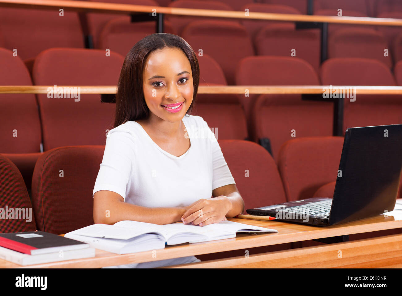 attractive African female university student looking at the camera ...