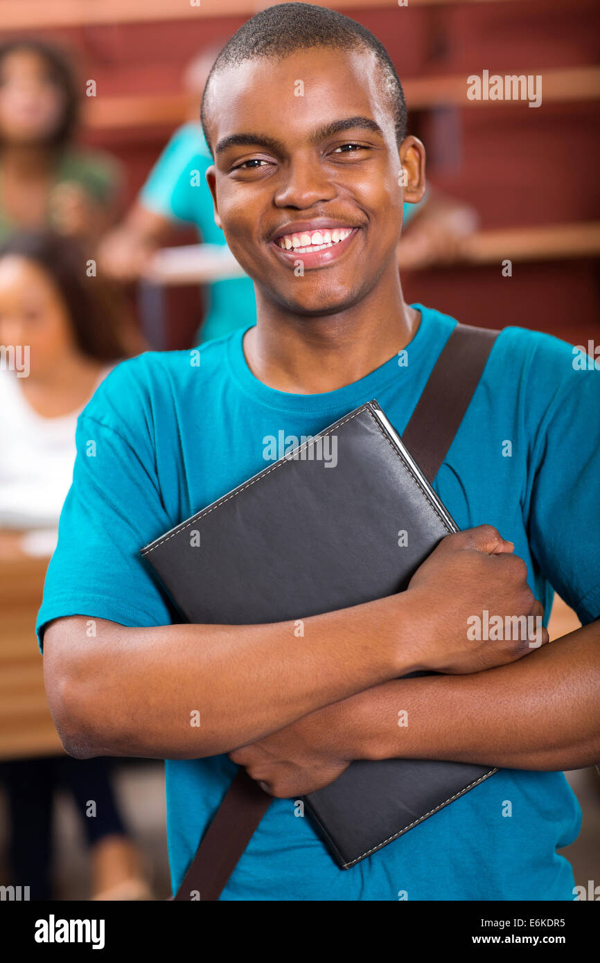 cheerful male African college student portrait in lecture room Stock Photo