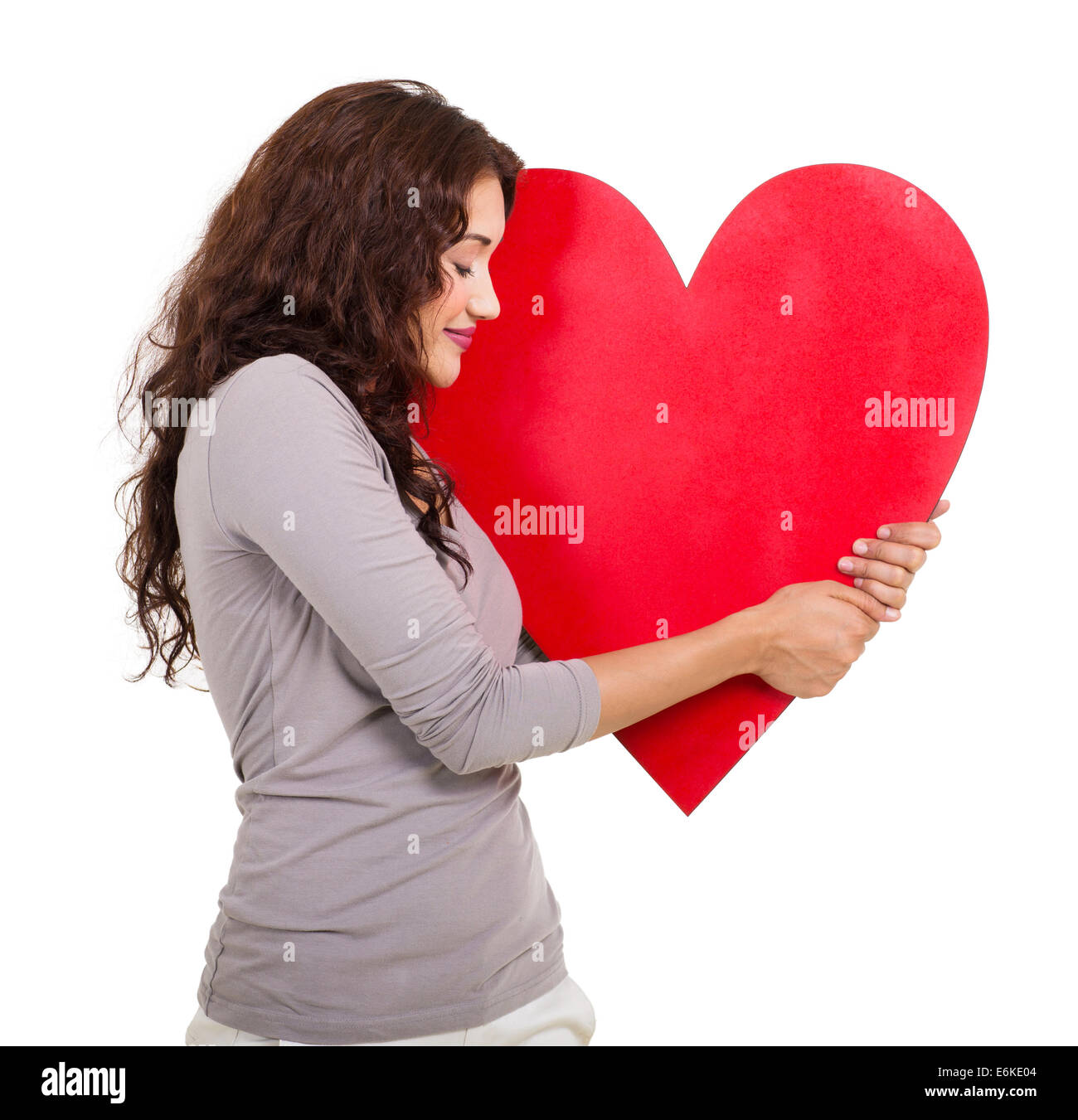 happy woman with hugging a heart shape isolated on white background ...