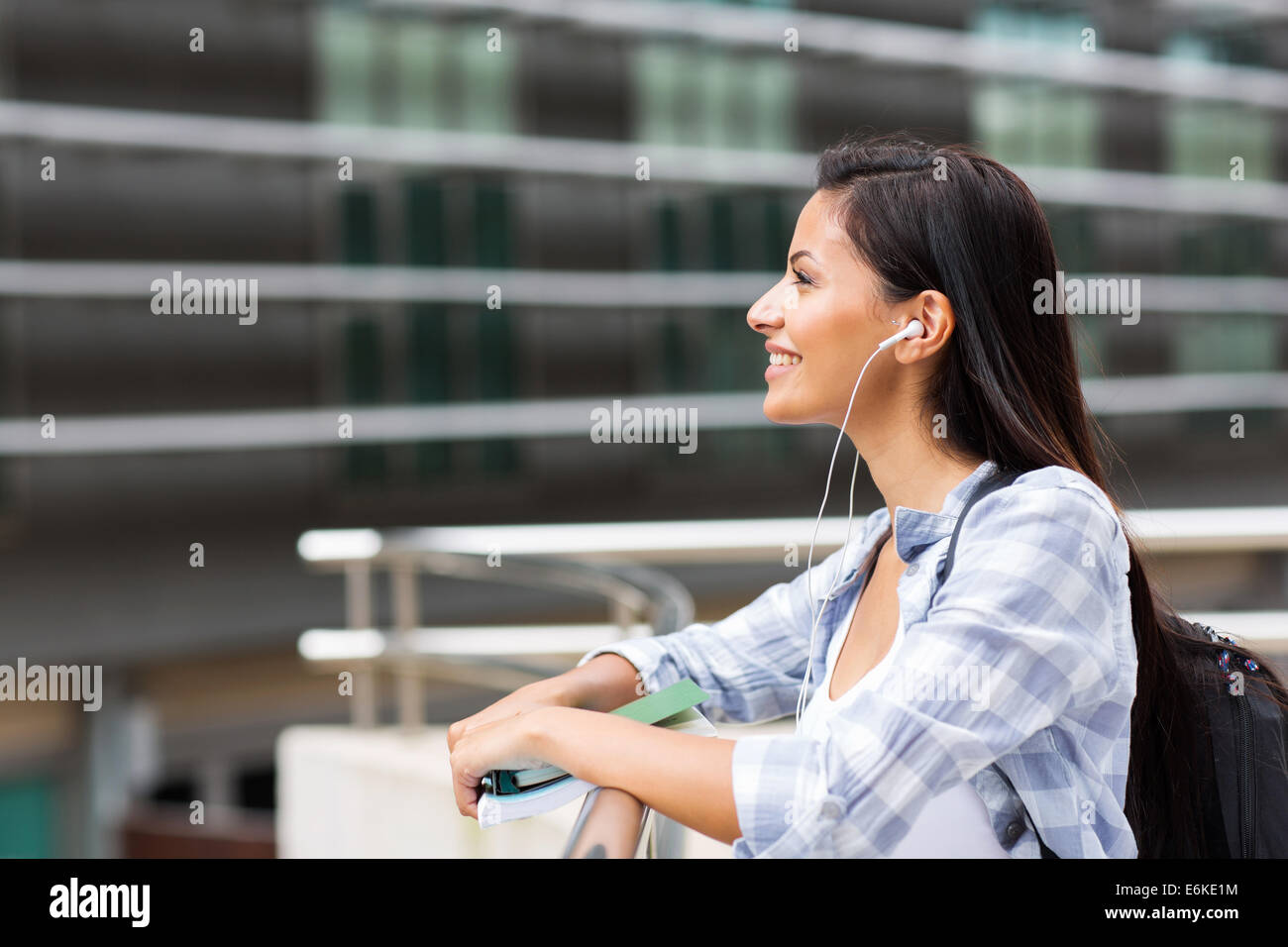 side view of happy female college student looking up Stock Photo