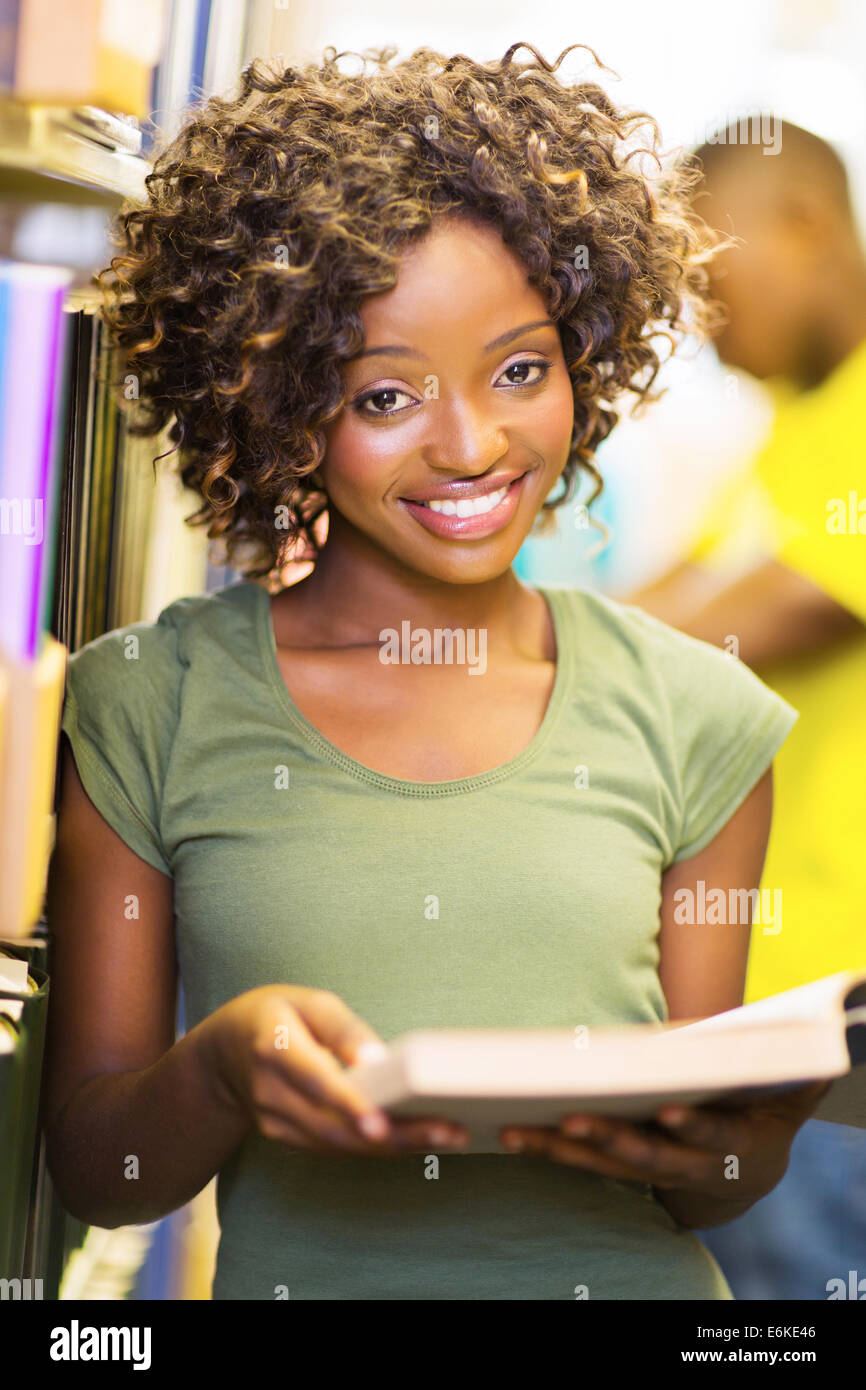 happy female African American college student in library Stock Photo ...