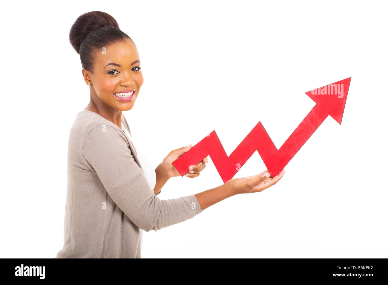 side view of young woman holding stock arrow isolated on white Stock ...