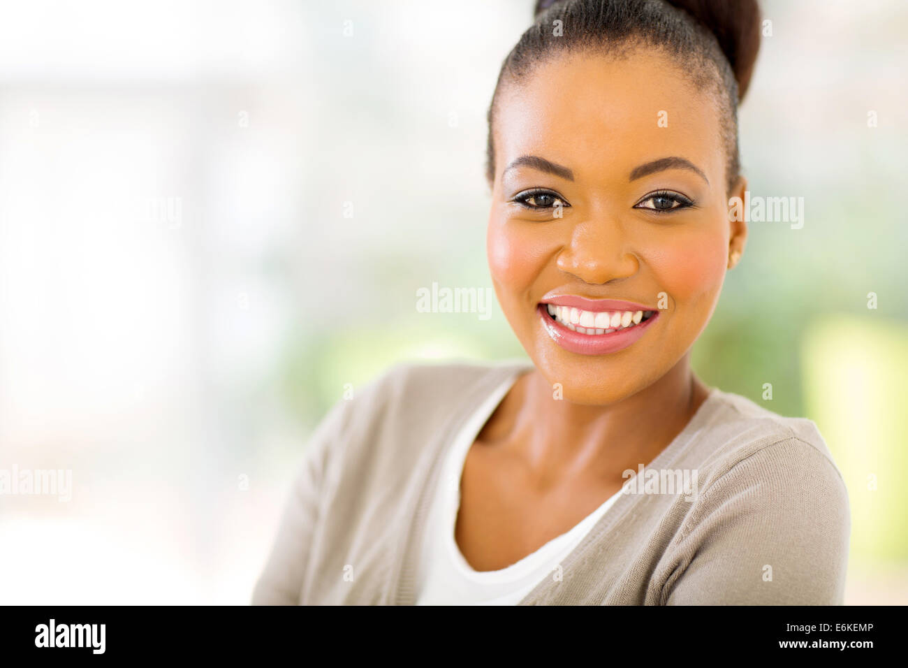 close up portrait of young African American woman at home Stock Photo ...