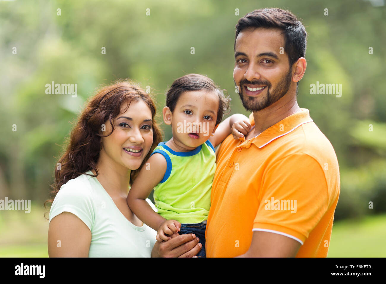 young happy Indian family with the kid outdoors Stock Photo - Alamy