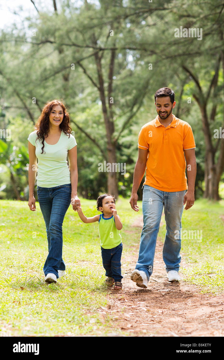 happy young Indian family walking in park Stock Photo - Alamy