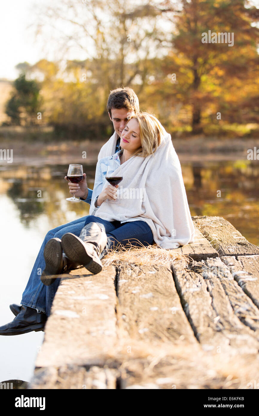 romantic young couple snuggle outdoors in autumn Stock Photo