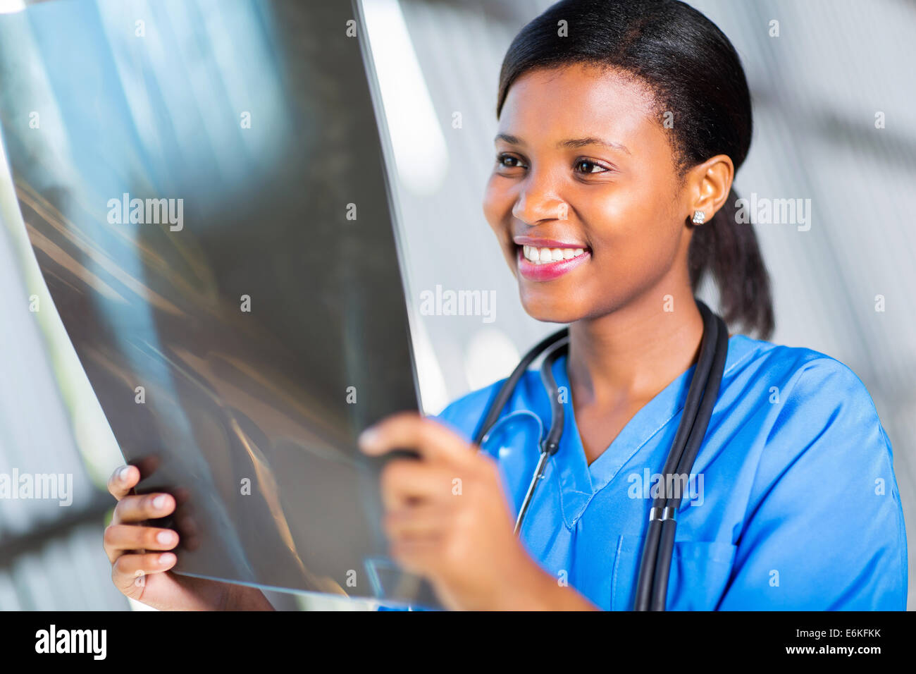 African doctor looking at patient's x-ray at hospital Stock Photo - Alamy