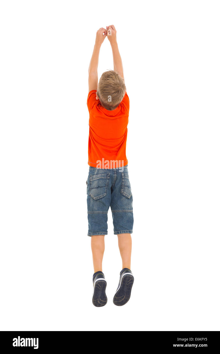 rear view of young boy jumping isolated on white background Stock Photo