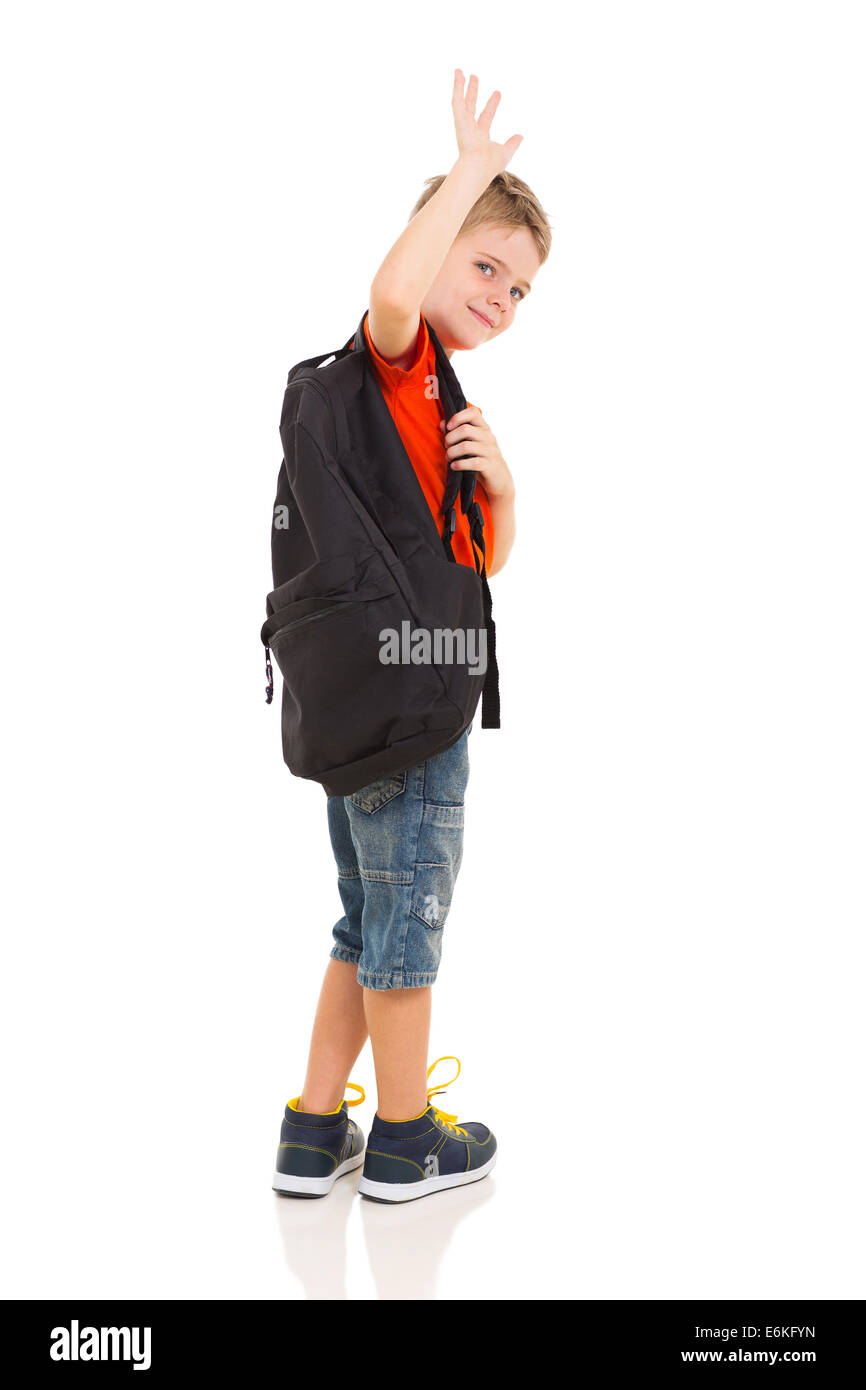 male elementary school student waving goodbye isolated on white background Stock Photo