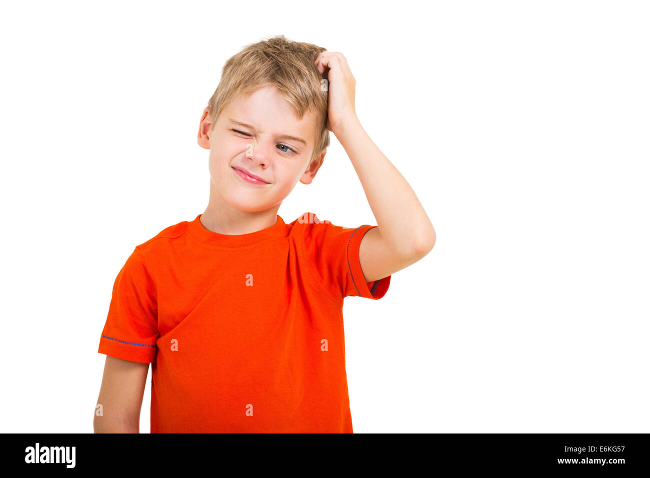 young boy scratching his head isolated on white Stock Photo