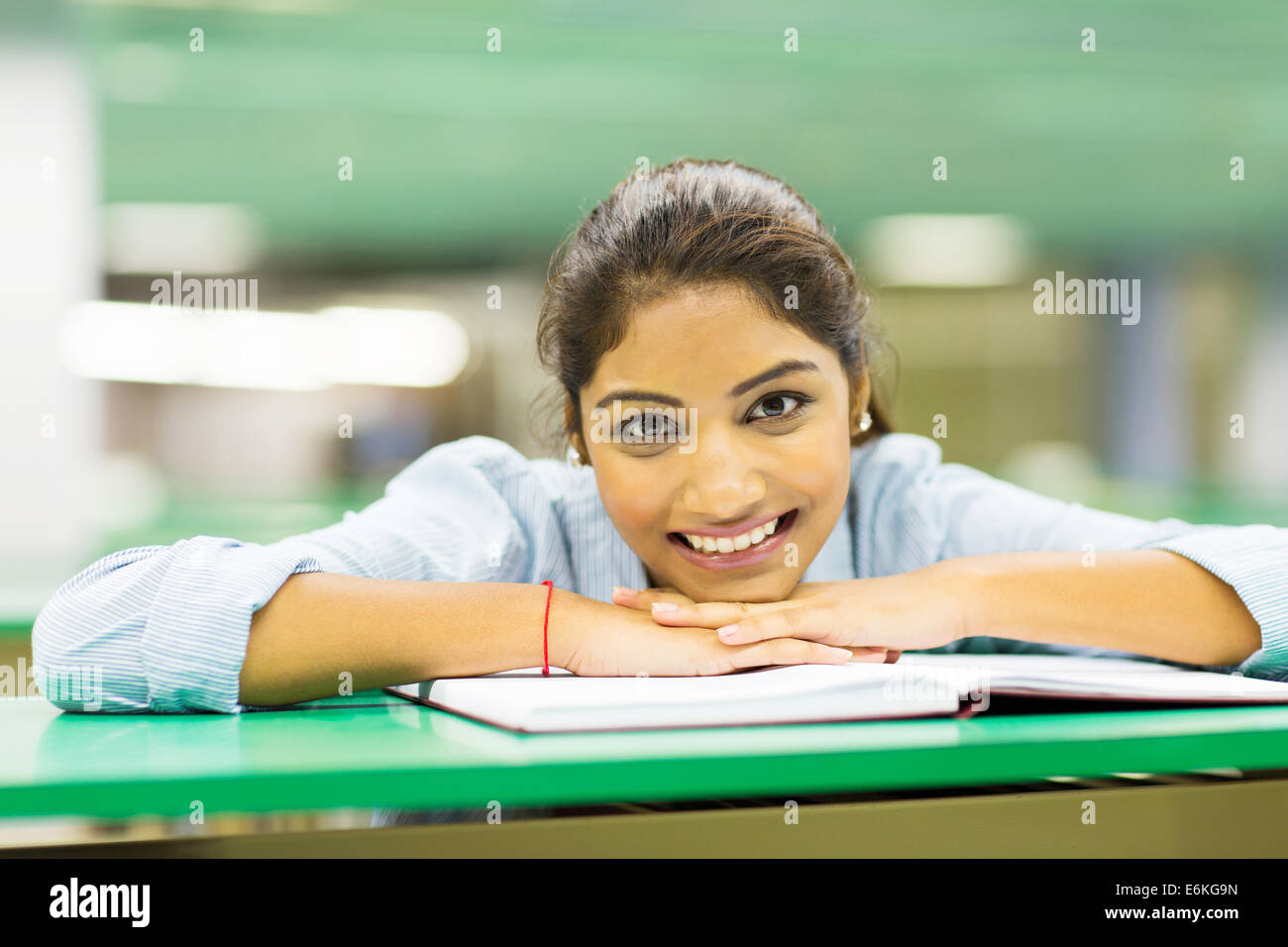 pretty female college student with book Stock Photo - Alamy