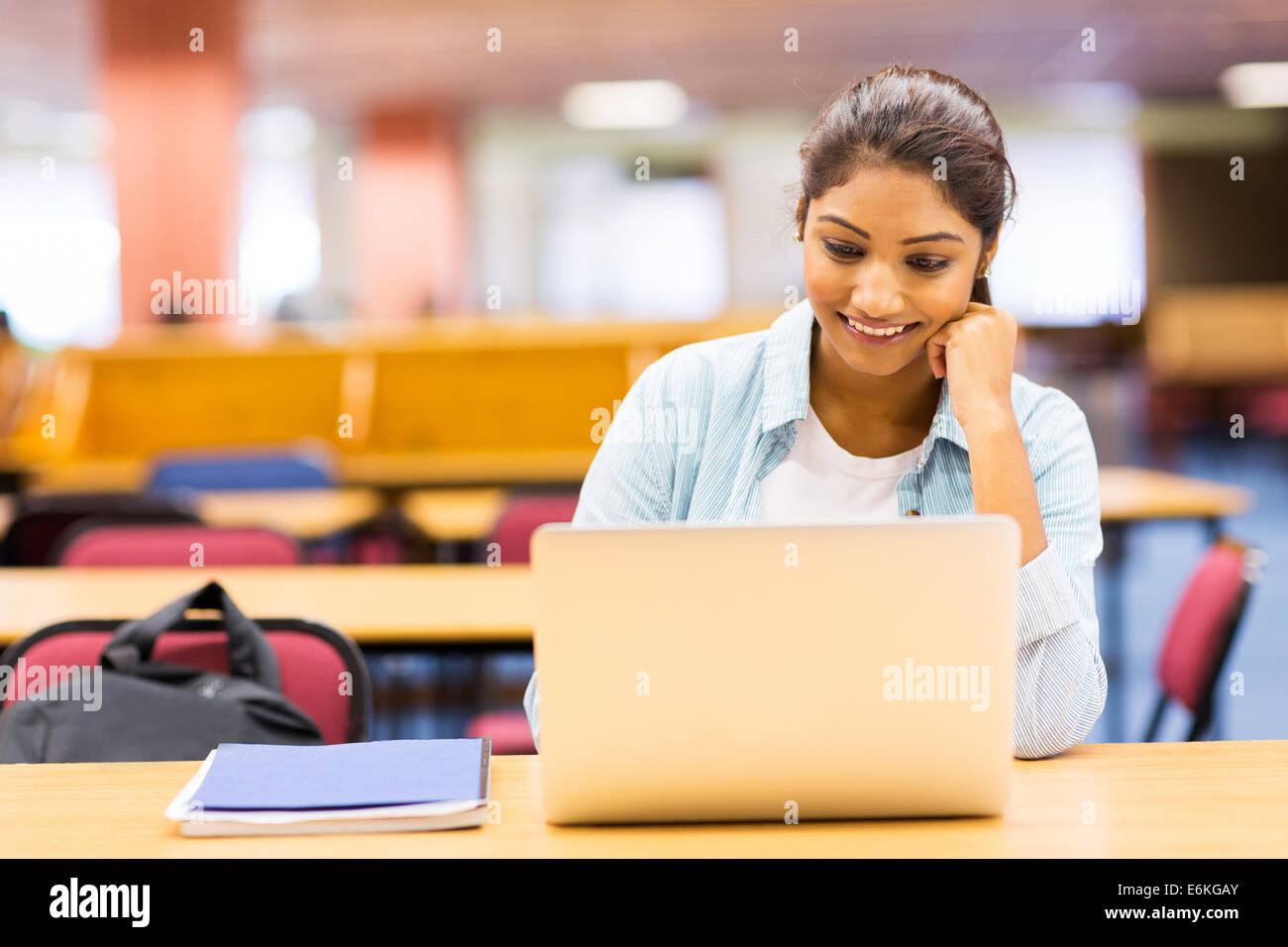 female Indian university student using laptop in lecture room Stock ...