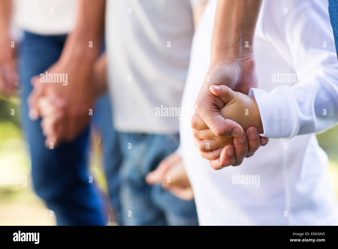 family holding hands close up Stock Photo