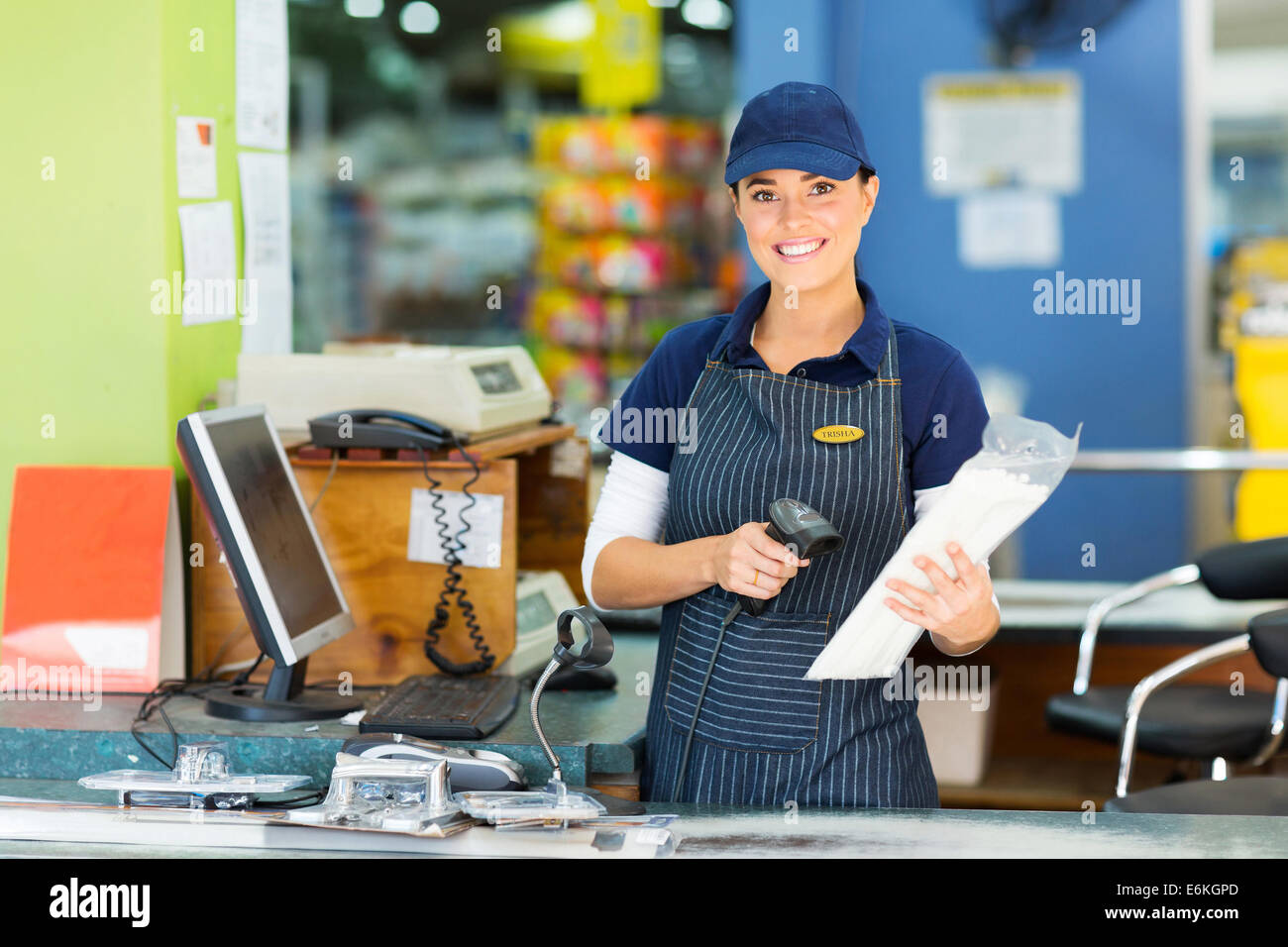 attractive female cashier at hardware store Stock Photo