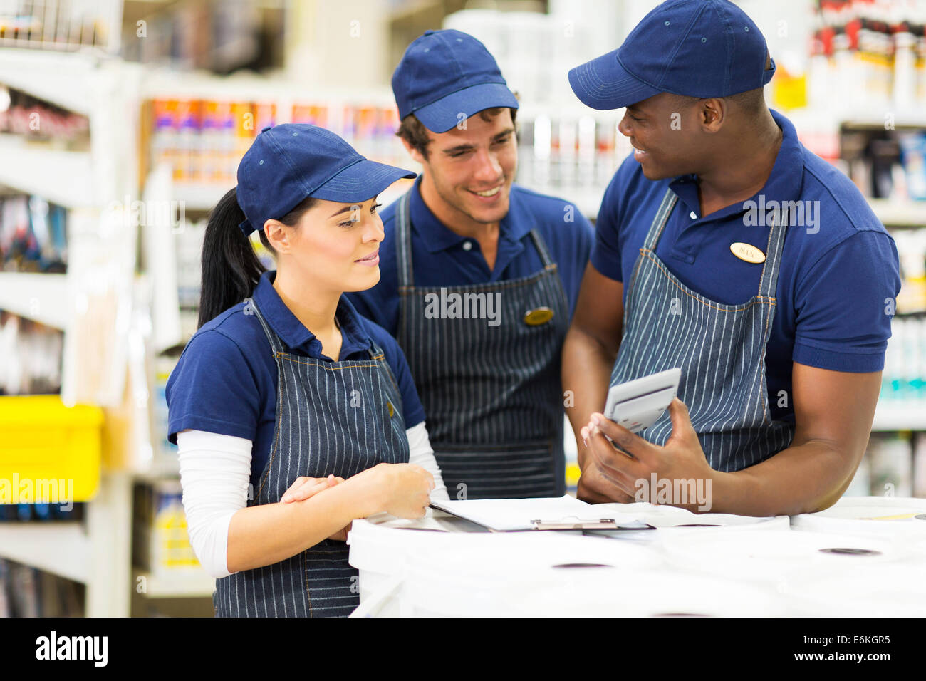 group of hardware store workers discussing work Stock Photo Alamy