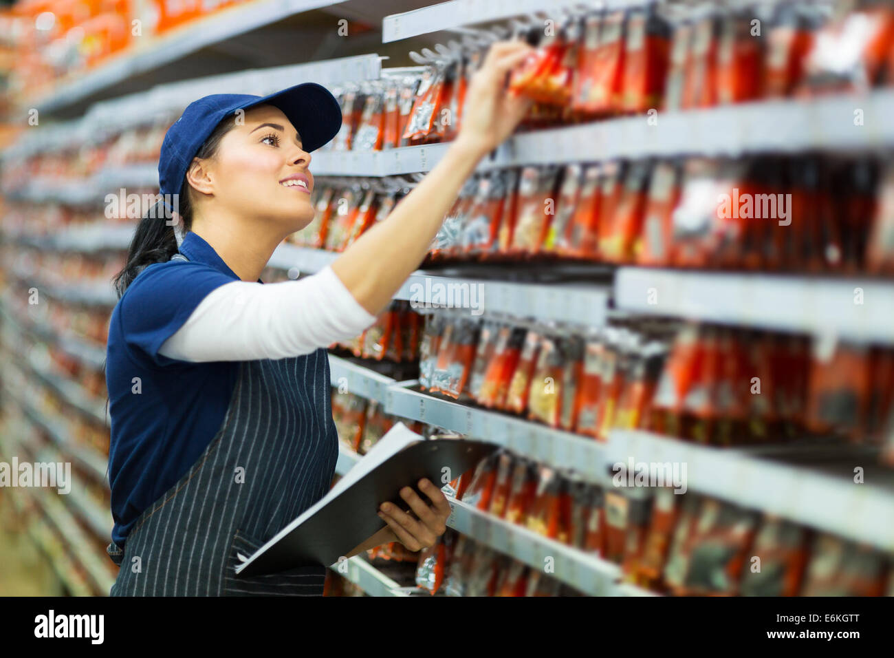 attractive hardware store worker counting stock Stock Photo