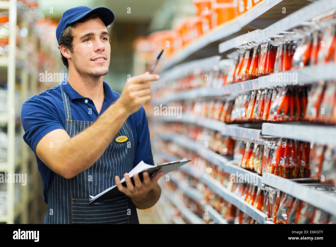 good looking hardware store worker counting stock Stock Photo Alamy