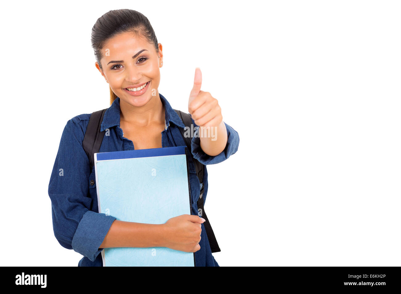 pretty female college student with happy smile giving thumbs up Stock Photo