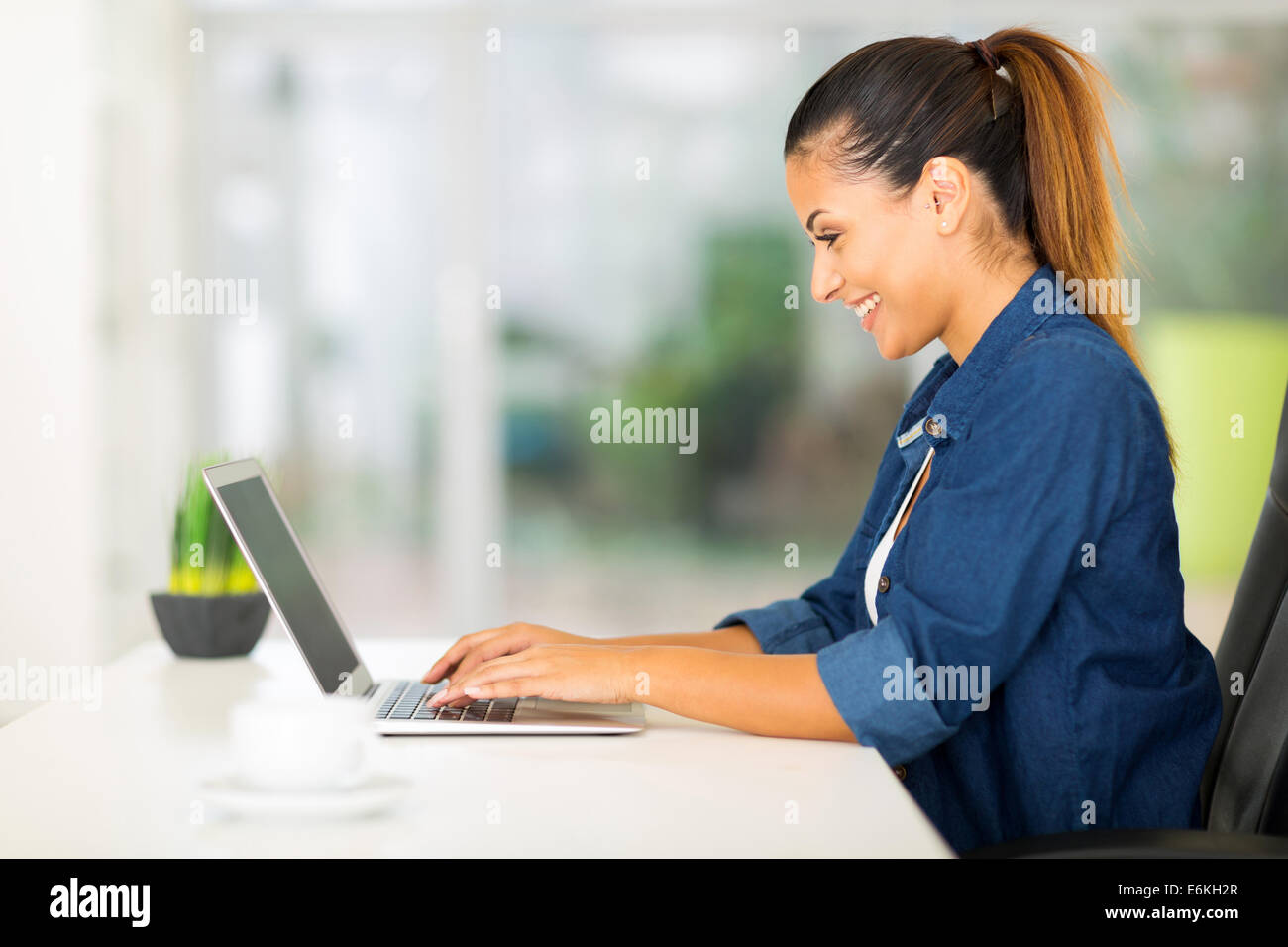 cheerful woman using laptop computer at home Stock Photo - Alamy